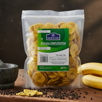 Neptune banana chips pepper package on a wooden surface with bananas and spices.